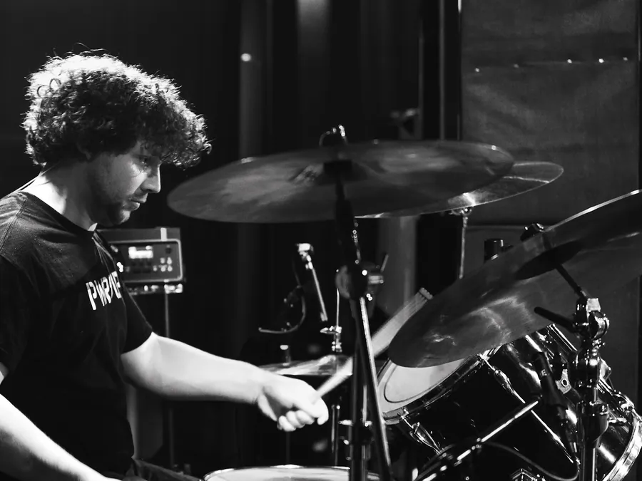 Andrew drumming, in black and white